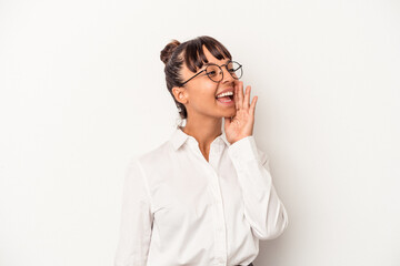 Young mixed race business woman isolated on white background  shouting and holding palm near opened mouth.