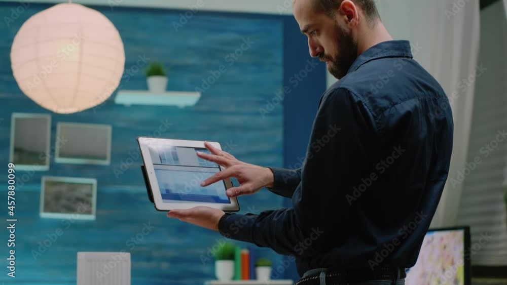 Poster close up of architect using tablet with touch screen to analyze building model for architectural dev