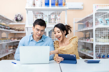 Business owners. Male and female successful small business owners sit down to discuss account balances, trade information, coffee shops, bakery, and convenience stores.