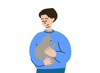 A man is holding a cat. A pet on your hands. A man with a kitten in his arms.