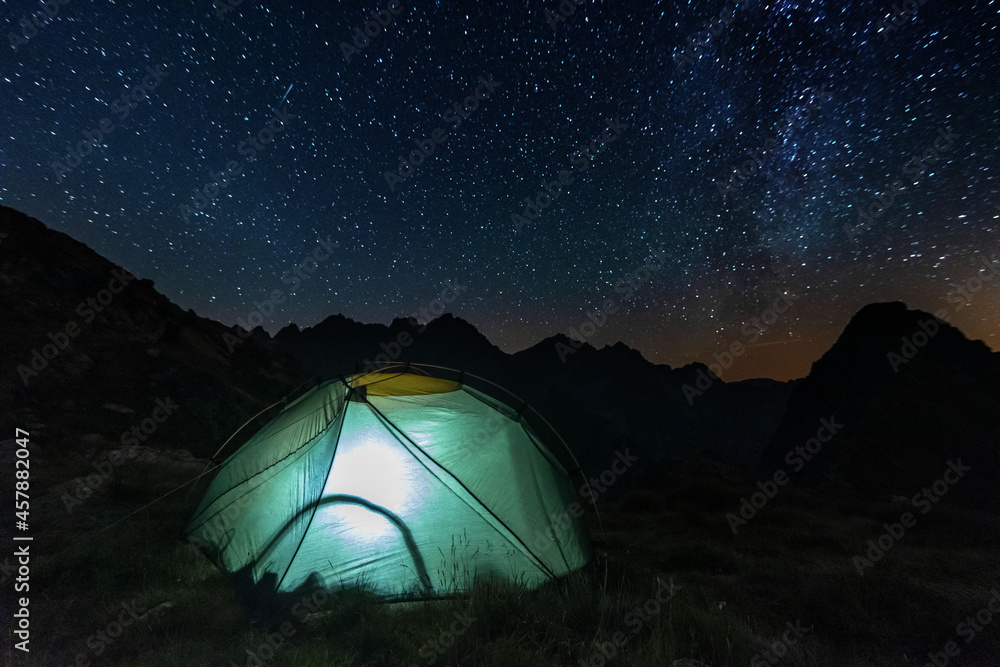 Wall mural bright starry sky with the milky way on the background of high tatras mountains