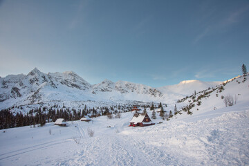 Beautiful winter views of the High Tatra Mountains with tourists, skiers and amazing states of nature	