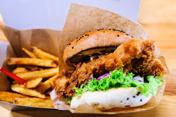  Classic fish and chips in a burger with french fries - obrazy, fototapety, plakaty