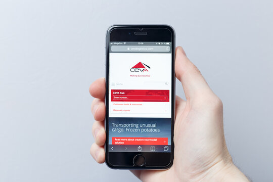 Moscow / Russia - 04.21.2019: A hand holding a smartphone which displays CEVA Logistics logo on the official website homepage. CEVA Logistics logo visible on smartphone screen. Illustrative editorial