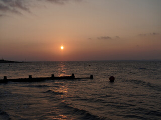 Sunset with Reflection in Ocean at Whitstable Beach 