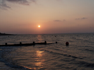 Sunset with Reflection in Ocean at Whitstable Beach 