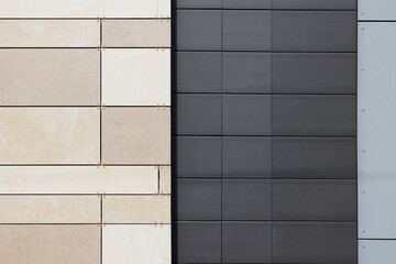 Combination of colors and different tiles on modern ventilated facades. Brown and black ceramic tiles on the facade of the house.