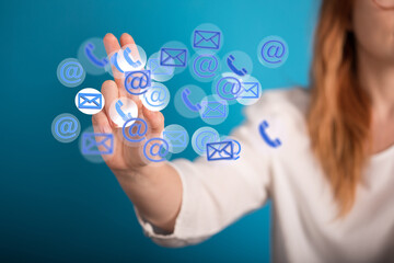 Hand holding using mobile phone with email icon on screen. Concept of business communication