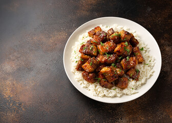 Chinese traditional cuisine sticky braised pork belly with rice on white plate