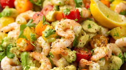 Prawn avocado salad with tomato cherry and herbs. Healthy food