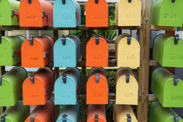 Dense rows of brightly colored mailboxes