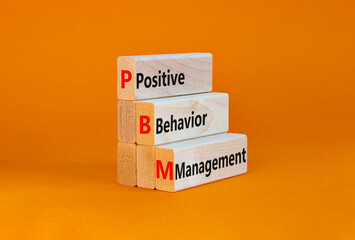 Positive behavior management symbol. Concept words Positive behavior management on blocks on a...