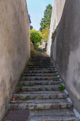 Narrow street with old stone steps, Partenay, Aquitaine, France
