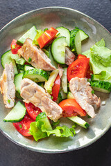 salad chicken breast meat vegetable tomato, cucumber, lettuce diet food meal snack on the table copy space food background keto or paleo diet veggie