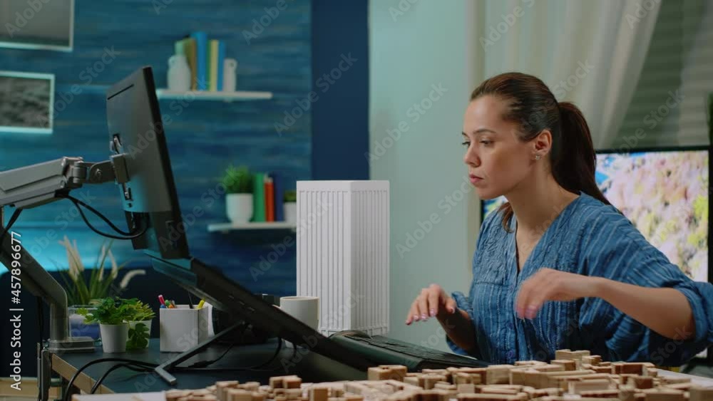 Poster woman working as architect analyzing virtual maquette on monitor with touch screen. engineer designi