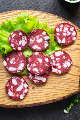 sausage meat pieces lard bacon beef or pork smoked or dry-cured meal snack on the table copy space food background rustic