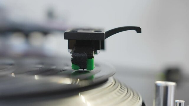 The closer look of the turntable machine with its stylus needle on the disck in Estonia