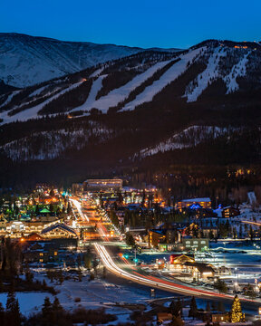 Winter Park Ski resort rises above the Christmas lights of the Town of Winter Park