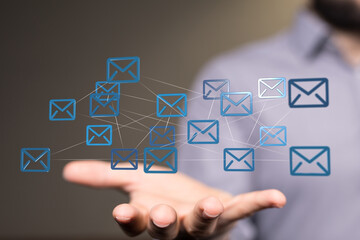 holding smartphone and checking email online on web with