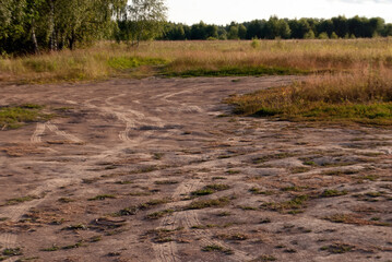 traces of car tires on the sand