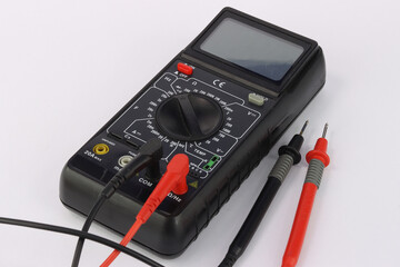 A multimeter for measuring parameters in an electrical panel and an electronic circuit.