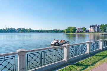 KALININGRAD, Koenigsberg , RUSSIA. Beautiful cityscape of Kaliningrad central park. Upper pond catamaran view.