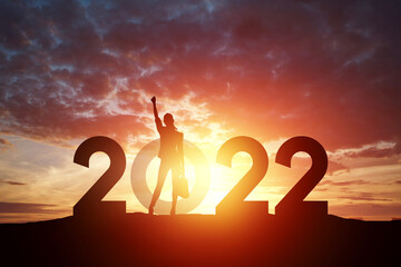 Girl as part of the 2022 sign on a sunset background. Happy New Year. Modern design, new year card, flyer, feminism.