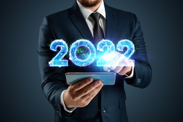 Blue hologram number 2022 on the background of a businessman. Happy New Year. Modern design, Template, header for the site, poster, New Year's card, flyer.