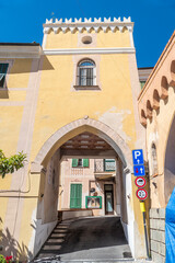 The entrance arch to the historic center of Diano Castello