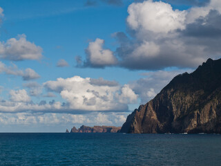 Fototapeta na wymiar Clouds over Madeira island coastline with blue sky
