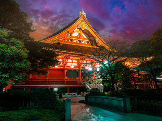 Obraz premium Evening in Japan. Buddhist temple on the background of beautiful evening sky. Asakusa at night. Sensoji Temple in Tokyo. Asakusa district. Tokyo in evening. Temple of Three Deities. Religion. Buddhism