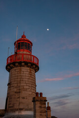 Dun Laoghaire lighthouse and moon in Dublin, Ireland