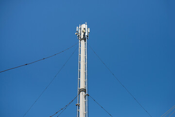 Tower with communications against the blue sky