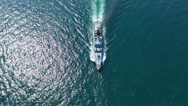 Navy Ship in the sea aerial view birds eye view of warship in the ocean