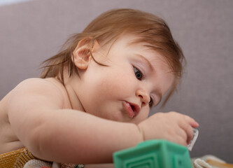 baby child is playing with toy