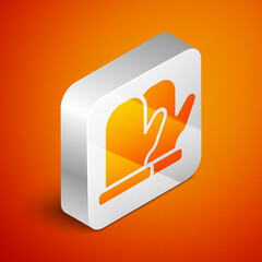 Isometric Christmas mitten icon isolated on orange background. Silver square button. Vector