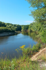 Fototapeta na wymiar Landscape with river in summer. River landscape with sandy banks