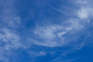 Cirrus clouds with a clear blue sky background on a Sunny Day in the morning.