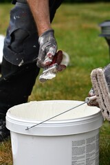 A man putting white color pencil for painting