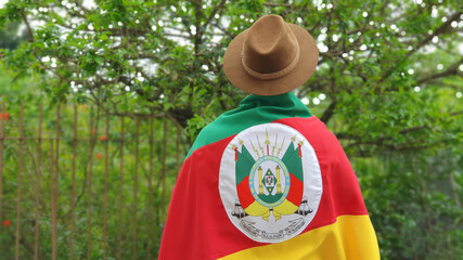 Young person with hat and flag of the state of Rio Grande do Sul - Southern Brazil. Farroupilha...