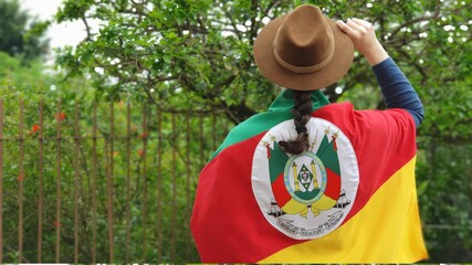 Brazilian woman with hat and flag of the state of Rio Grande do Sul - Sul do Brasil. Farroupilha...