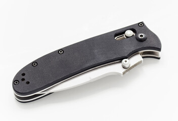 Folding knife in a folded position on a white background