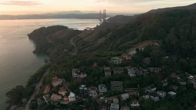Aerial: sausalito residential housing and golden gate bridge. San Francisco, USA