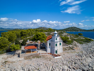 The lighthouse of Murter on the island Prisnjak in Croatia from drone view