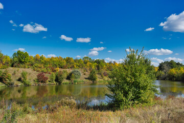 Autumn landscape with lake and trees, lake in the forest