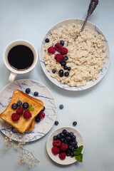 oatmeal porridge with milk, cereals, toast, coffee for breakfast