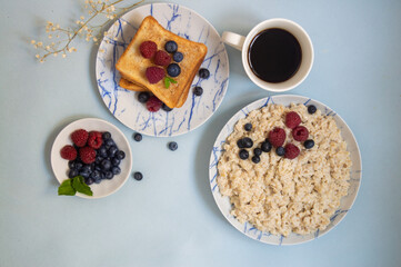 oatmeal porridge with milk, cereals, toast, coffee for breakfast