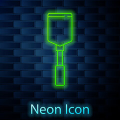 Glowing neon line Spatula icon isolated on brick wall background. Kitchen spatula icon. BBQ spatula sign. Barbecue and grill tool. Vector