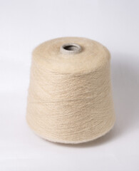 bobbin of yarn on a white background. Side view.Textile reel on