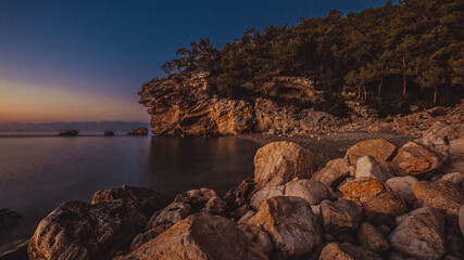 rocky coast of the mediterranean sea at dawn